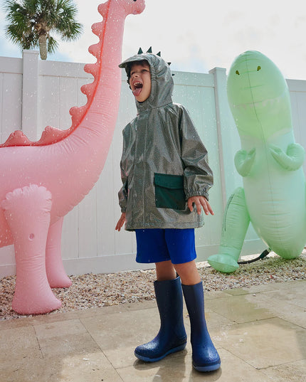 Boy wearing dino sparkle magnetic raincoat