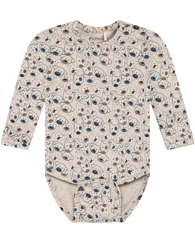 A long-sleeve beige baby bodysuit with an all-over cartoon dog print. The print features navy blue, brown, and black details.