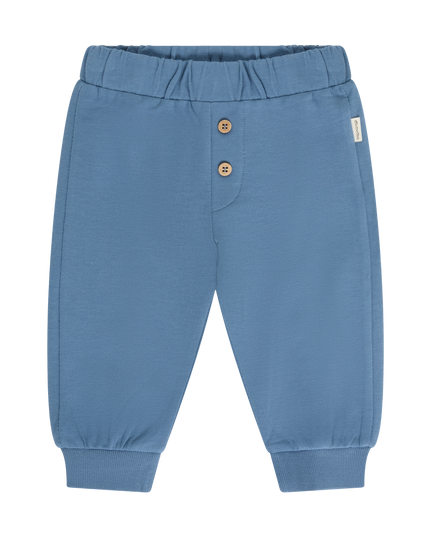 A pair of blue baby jogger pants featuring an elastic waistband, two decorative brown buttons on the front, and ribbed ankle cuffs