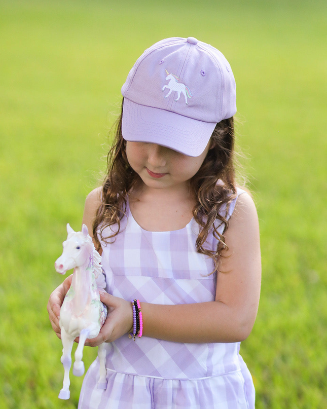 Girl wearing Rainbow Unicorn Bow Baseball Hat