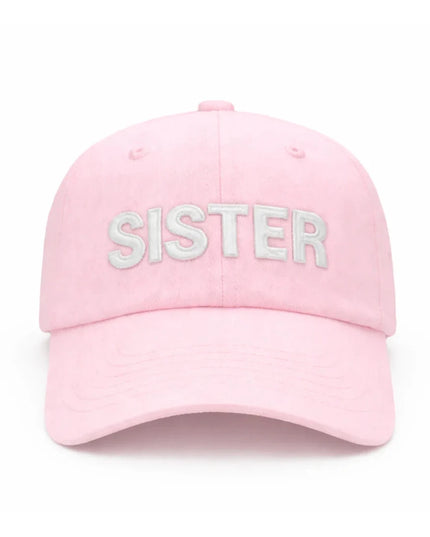 Pink baseball hat with 'SISTER' on front and white bow in the back