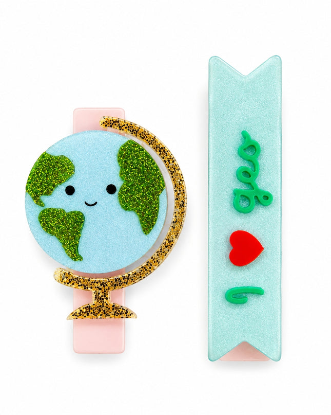 Hair clips with a smiling globe and rectangular clip that says 'I heart geo'