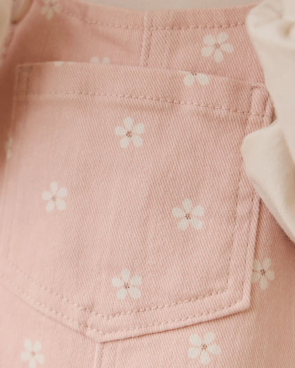 closeup of pink fabric with white flowers