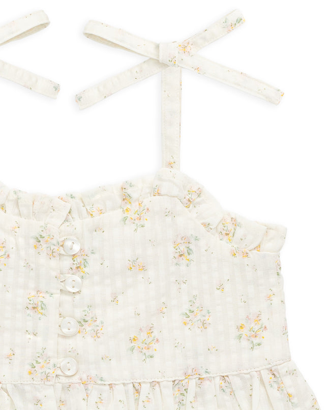 close up of cream and floral tank with tie sleeves