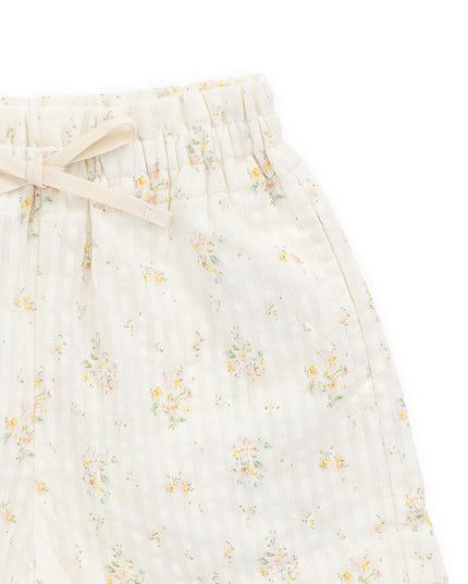 close up of cream shorts with floral pattern