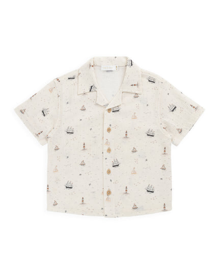 Cream colored shirt with sailboat print
