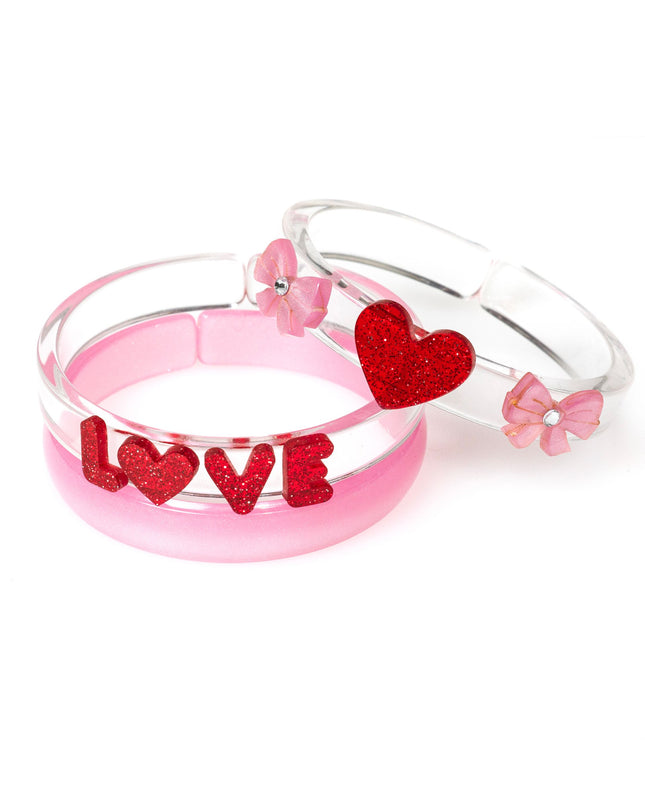 Pink and clear bracelets with LOVE, hearts and bows