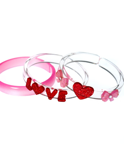 Pink and clear bracelets with LOVE, hearts and bows