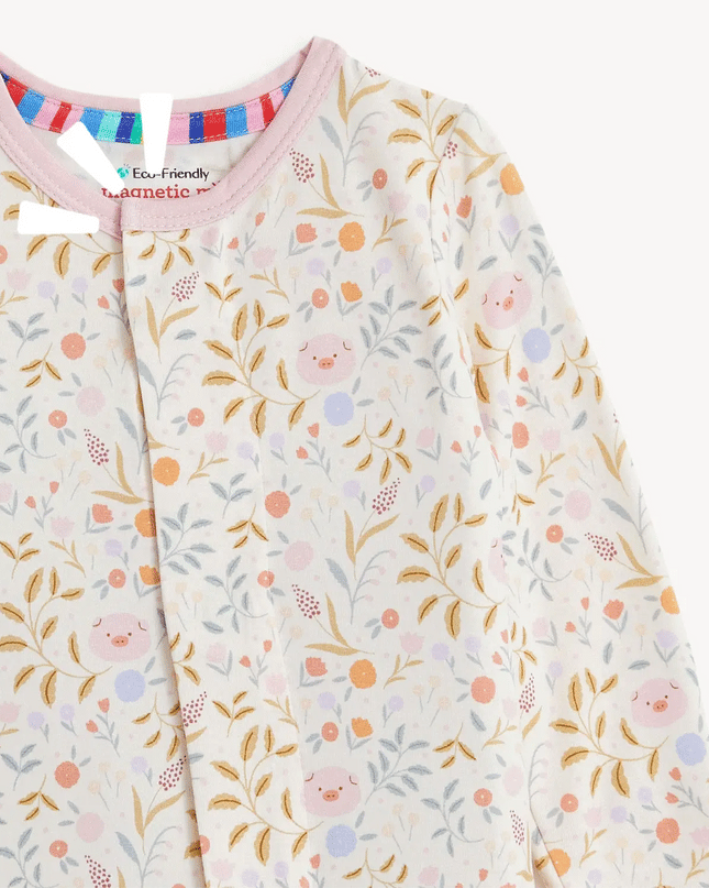 Floral and piglet patterned baby onesie