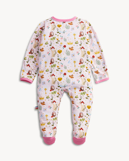 A baby footed pink sleeper with a colorful woodland fairytale pattern of trees, flowers, and crowns, finished with pink trim on the collar and cuffs.