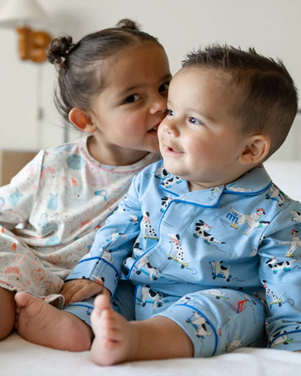 A boy and girl wearing dog pajamas