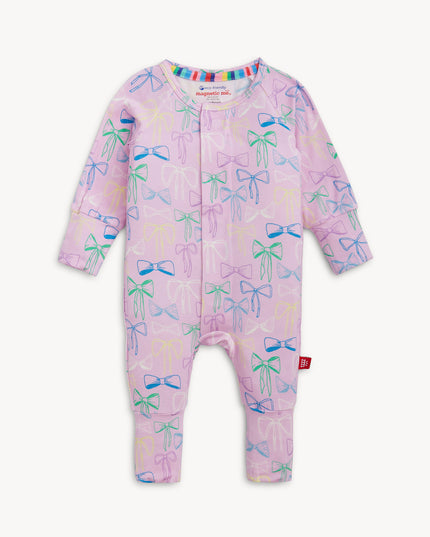 Purple convertible pajamas with bow pattern and magnetic closure