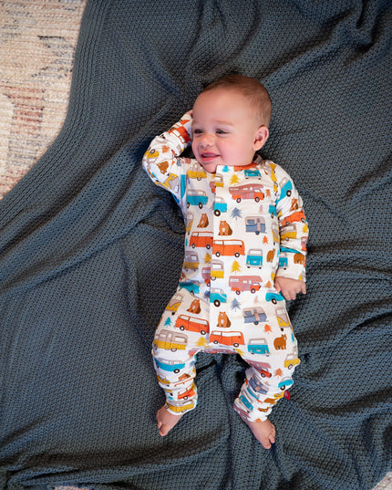 baby wearing onesie with colorful camping and van pattern