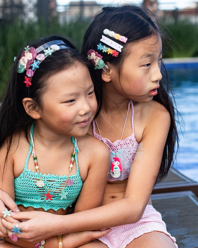 Girls wearing fun mermaid inspired hair accessories