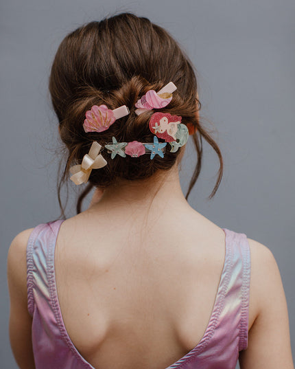 Girl wearing fun mermaid inspired hair accessories