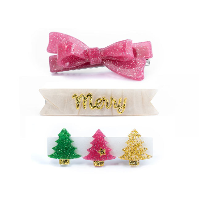 Clip set featuring a pink glitter bow clip, a pearly “Merry” clip, and a clip featuring a row of glittery Christmas trees