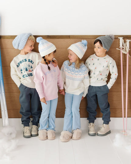 Kids wearing coordinating ski themed outfits