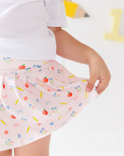 Girl wearing  Pink skort with back to school design