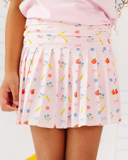 Girl wearing Pink skort with back to school design