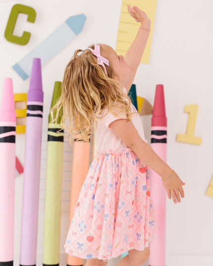 Girl wearing Pink tutu dress with back to school design