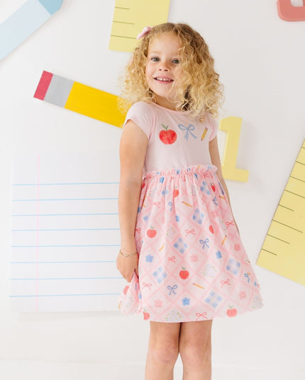 Girl wearing Pink tutu dress with back to school design