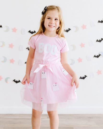 A girl wearing a pink tutu dress with sequin 'Boo' and ghost details