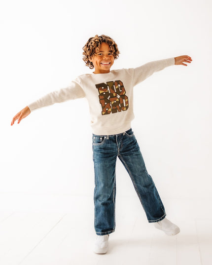 Bow wearing sweatshirt with 'BIG BRO' camouflage patch design