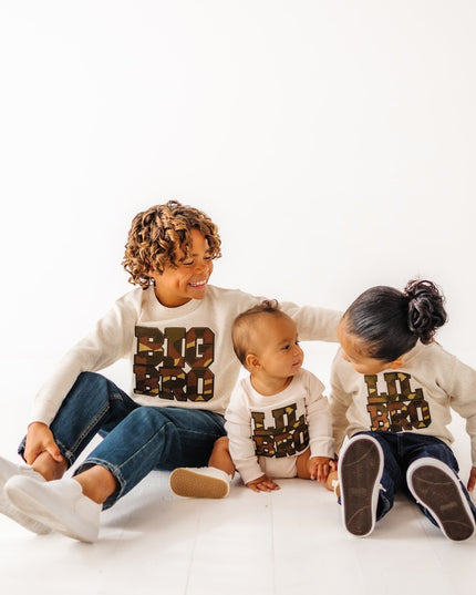 boys wearing matching big bro and lil bro camouflage patch sweatshirts