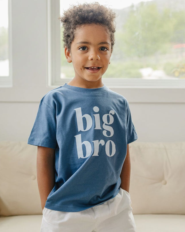 Boy wearing a blue 'big bro' shirt