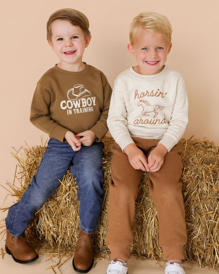 Boys wearing western themed outfits