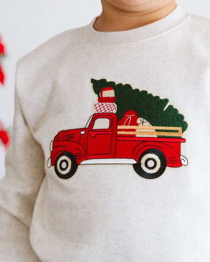 Natural color sweatshirt with red truck carrying a Christmas tree patch