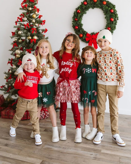 Kids wearing festive Christmas outfits