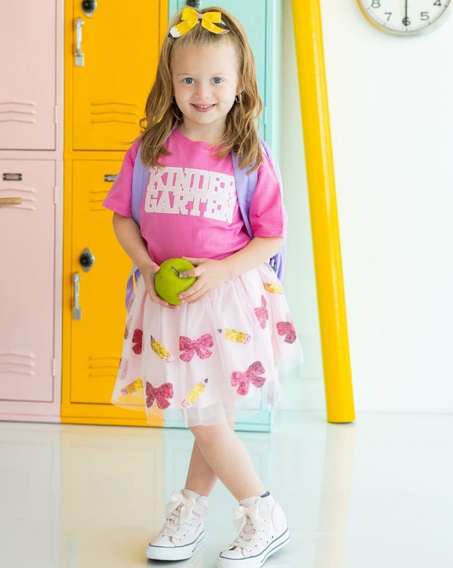 Girl holding an apple wearing Pink Short Sleeve T-Shirt with Kindergarten Sequin Patch and tutu with sequin pencils and bows