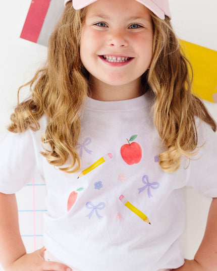 Girl wearing White t-shirt with back to school design