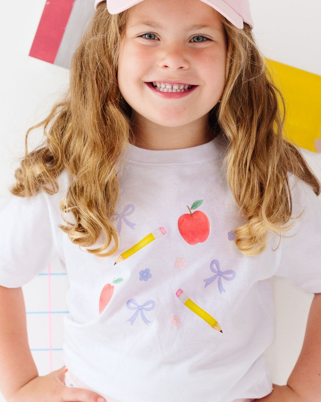 Girl wearing White t-shirt with back to school design
