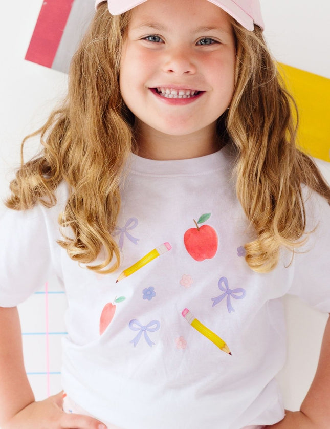 Girl wearing White t-shirt with back to school design