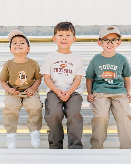 Boys wearing fun football themed outfits