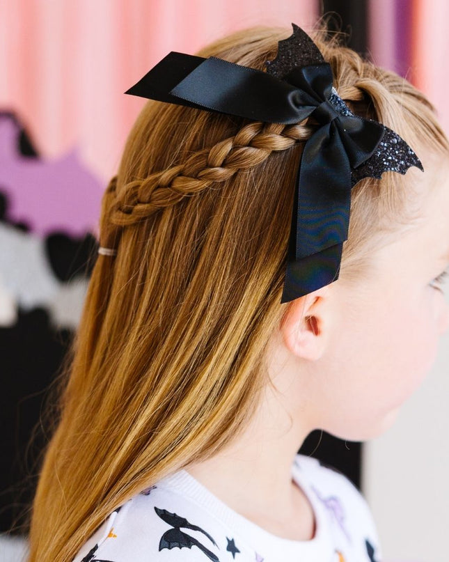 Girl wearing Glitter Bat Halloween Coquette Bow Clip