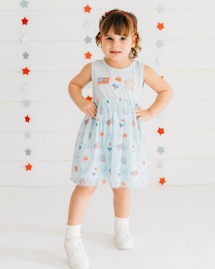 Girl wearing blue dress with patriotic pattern