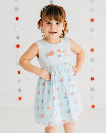 Girl wearing blue dress with patriotic pattern