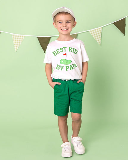 boy wearing white t-shirt that says best kid by par with golf flag graphic 