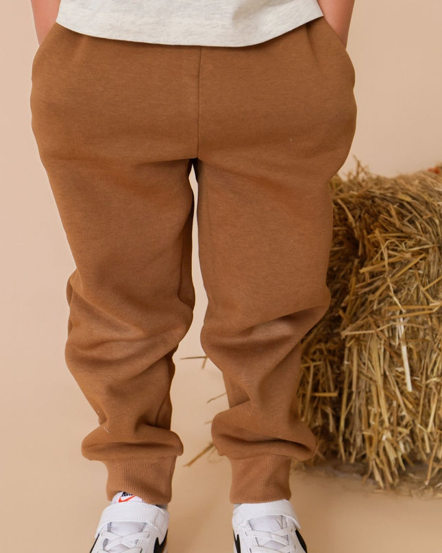 Boy wearing Brown drawstring joggers