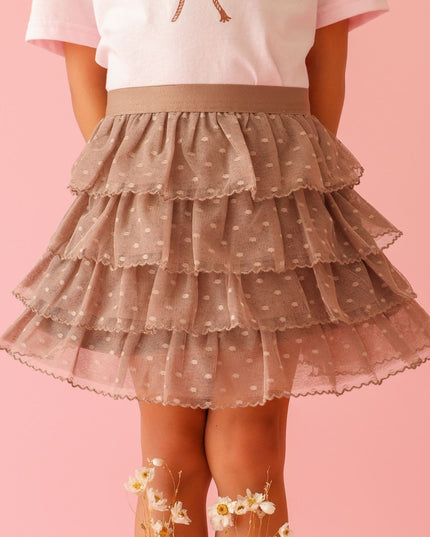 Girl wearing brown polka dot ruffle tutu skirt