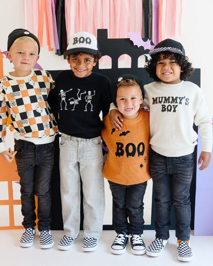 Boys wearing various halloween outfits
