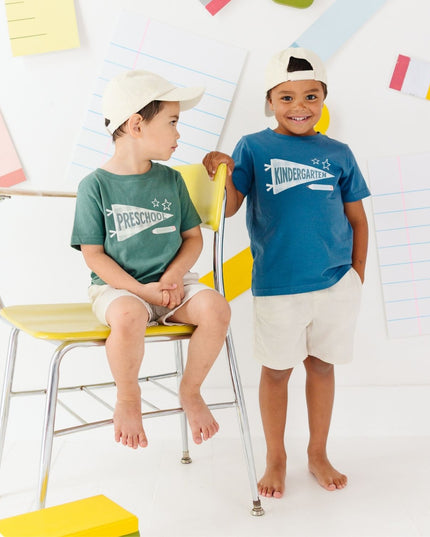 Boys wearing t-shirts with 'preschool' and 'kindergarten' banners