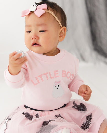 Baby wearing Pink baby romper with 'LITTLE BOO' text and ghost patch