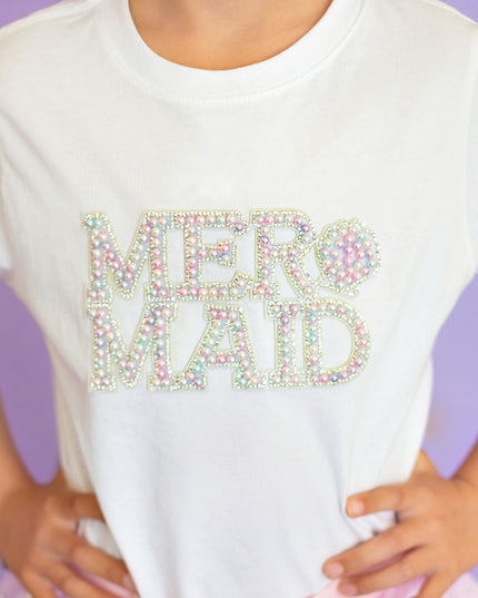Girl wearing white t-shirt with pearl mermaid patch