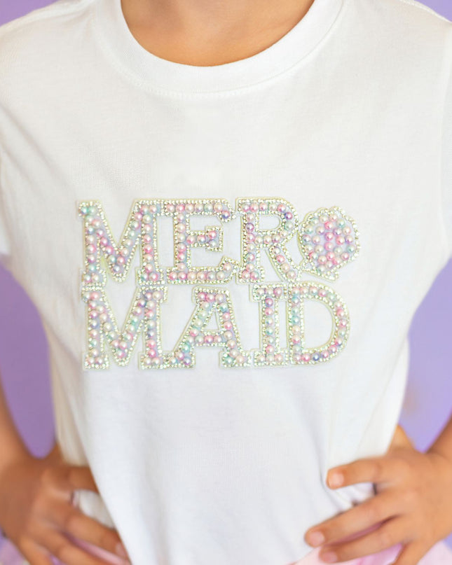Girl wearing white t-shirt with pearl mermaid patch