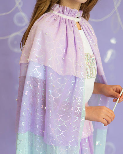Girl wearing pastel mermaid cape