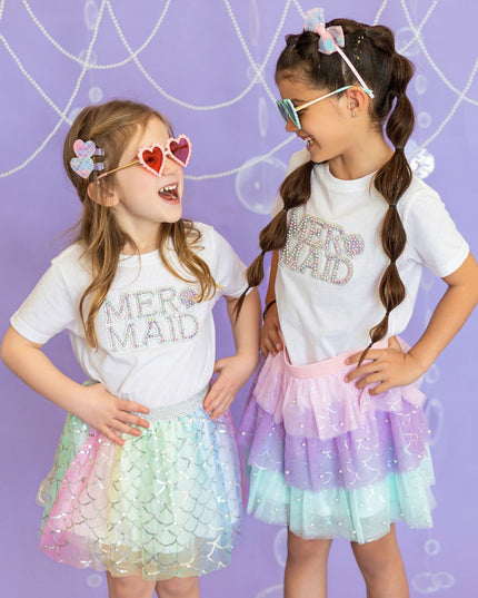 Two girls wearing coordinating mermaid outfits